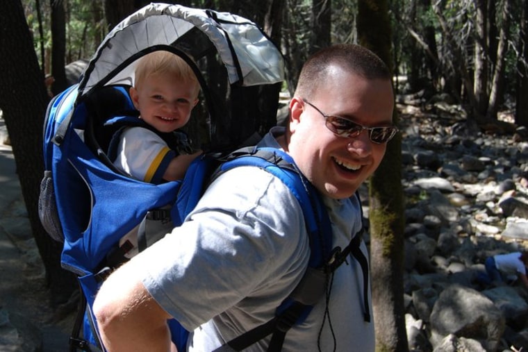 Bert Owlett giving son John a lift while hiking in Yosemite.