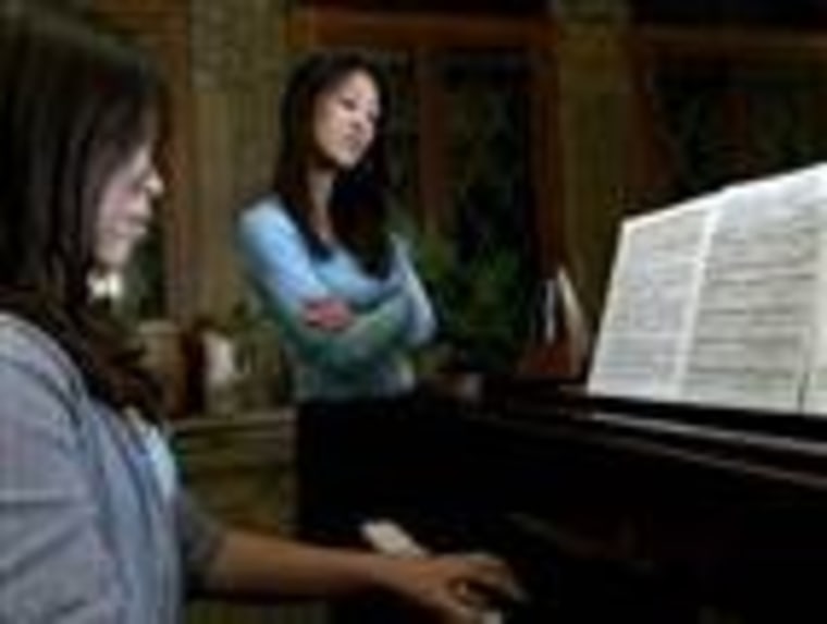 Amy Chua supervises piano practice.