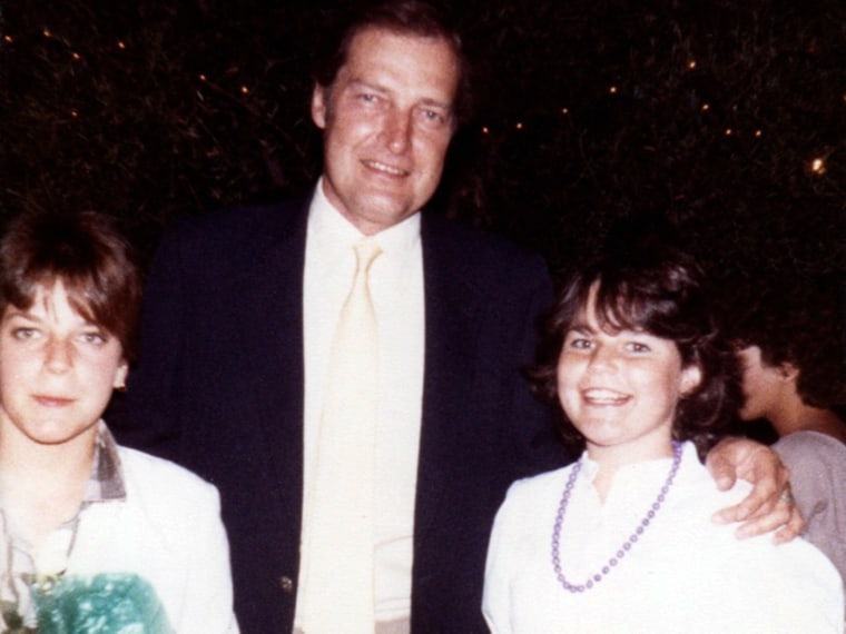 Savannah Guthrie, on right in white dress and purple necklace, with her father.