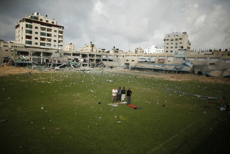 Prayers on a bombed soccer field in Gaza