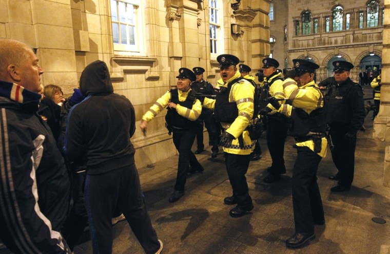 Cops hurt as British unionist protesters try to storm Belfast City Hall ...