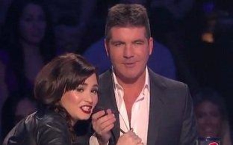 Demi Lovato grabs the mic and blasts one of Simon Cowell's acts on \"The X Factor.\"