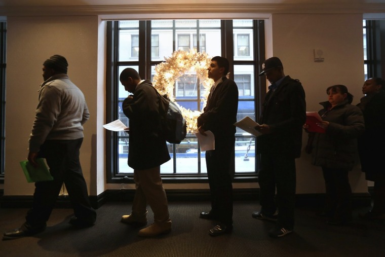 Applicants line up to meet potential employers at the Diversity Job Fair on December 6, 2012 in Manhattan, New York City.