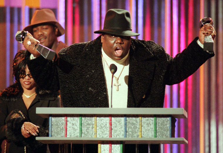 New details have been revealed in the death of Notorious B.I.G., whose real name was Christopher Wallace, seen here holding his awards at the 1995 Billboard Music Awards.