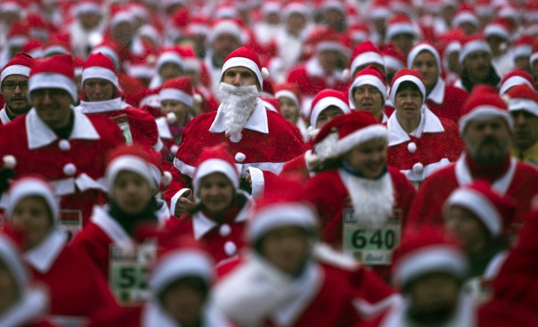 Santa stampede! Germans run in red suits and beards