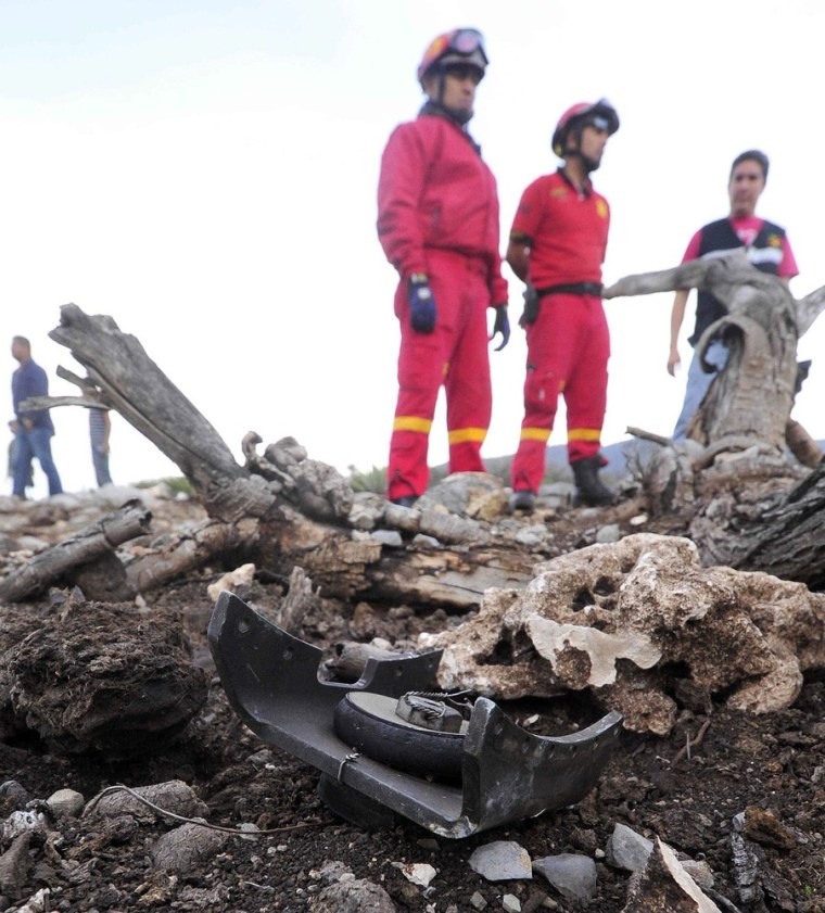 Federal authorities inspect the site of the plane crash in El Tejote locality, Nuevo Leon State, Mexico, where Mexican-American singer Jenni Rivera along with six other people died as they were travelling from Monterrey, in northern Mexico, to Mexico City.