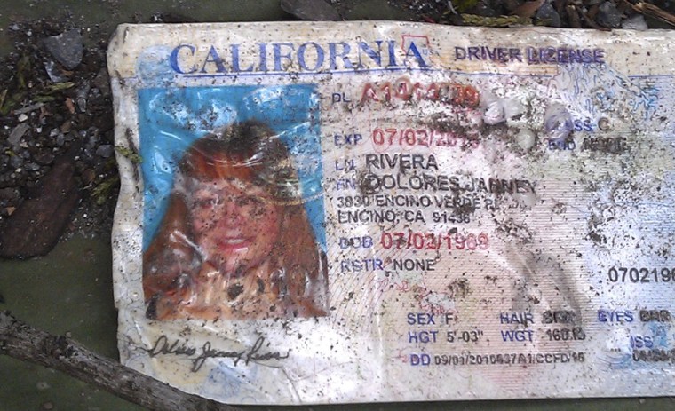 Jenni Rivera's driving license is seen of the ground at the crash site where a plane allegedly carrying Rivera crashed near Iturbide, Mexico, Dec. 9.