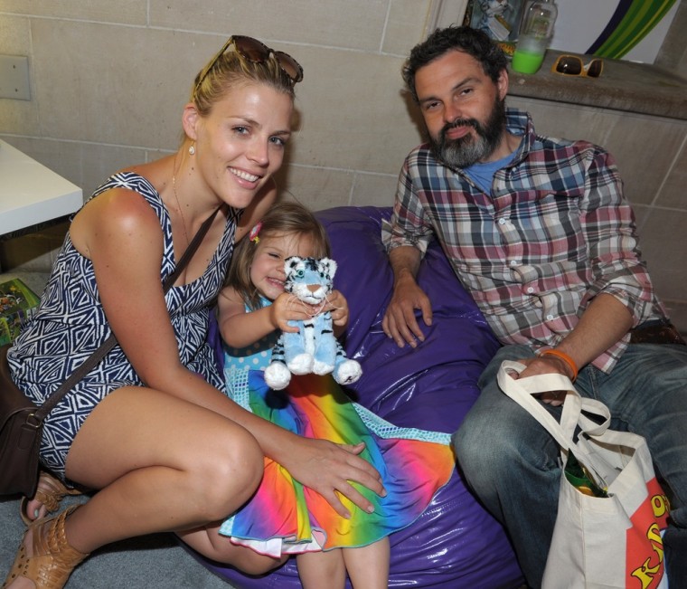 Actress Busy Philipps, left, and husband Marc Silverstein, with daughter Birdie in Beverly Hills in June 2011.