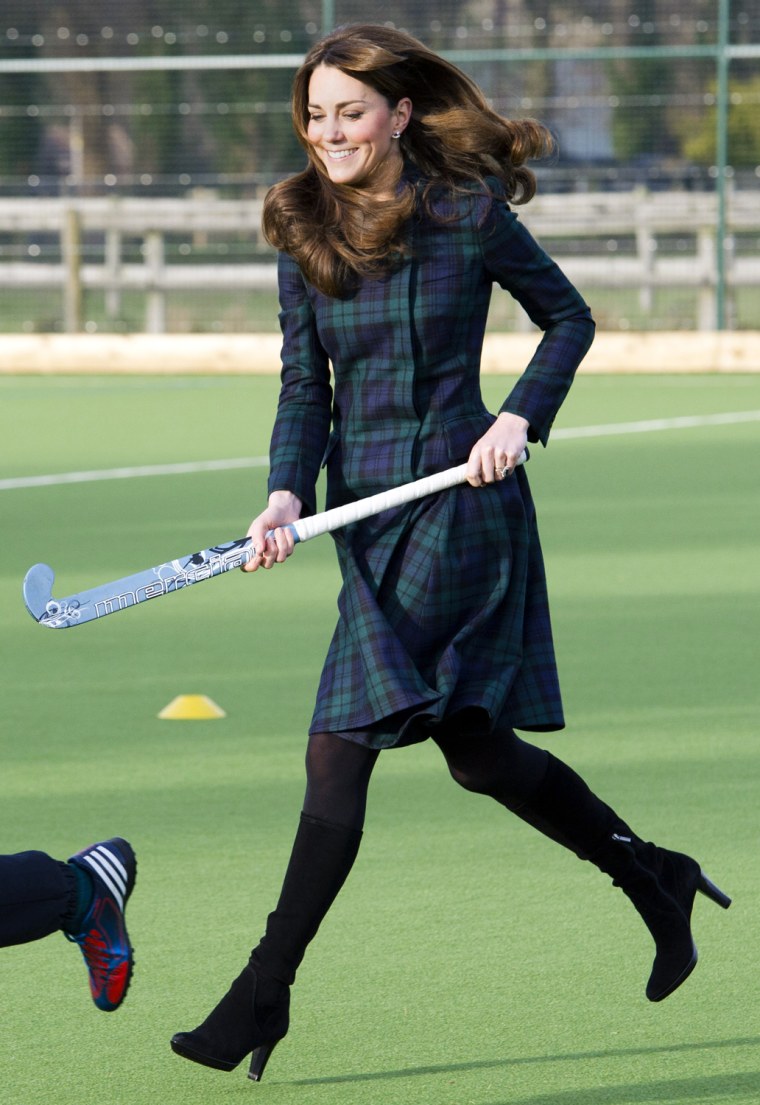 Kate Middleton, the Duchess of Cambridge, plays hockey during her visit to St. Andrew’s School in Pangbourne, England, Nov. 30, 2012.