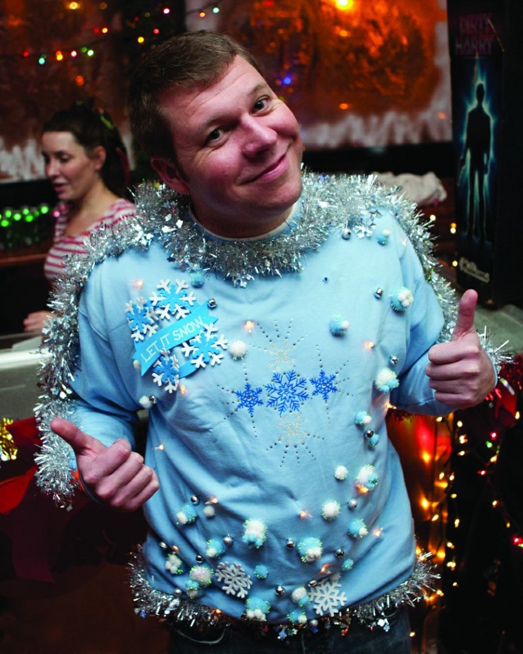This holiday sweater deserves two thumbs up.