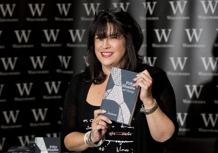 E L James, author of Fifty Shades of Grey, poses for photographers during a book signing in London.