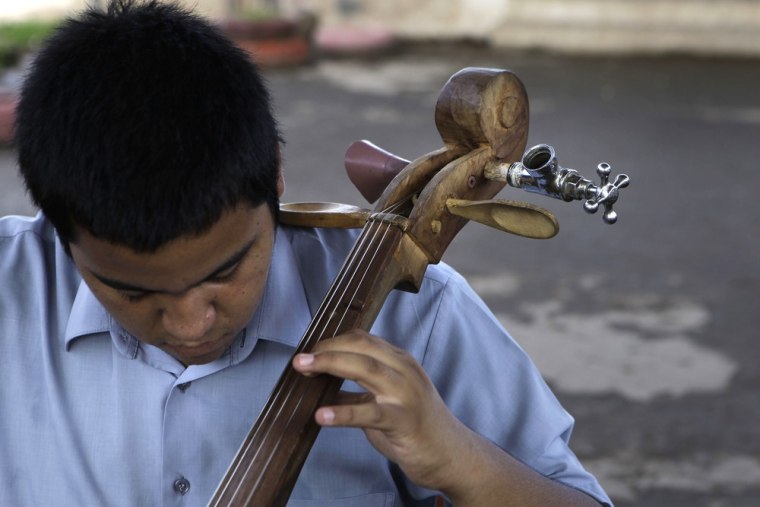 'A way out of the landfill' Paraguay kids play Mozart with violins