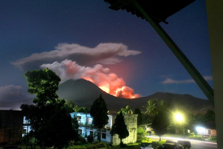 Mount Lokon erupts as seen  from Tomohon, North Sulawesi, Indonesia, July 15. Indonesian authorities raised the alert at the volcano on Sulawesi island to the highest level and urged the evacuation of the danger zone. More than 30,000 people live near the volcano, according to the local government.