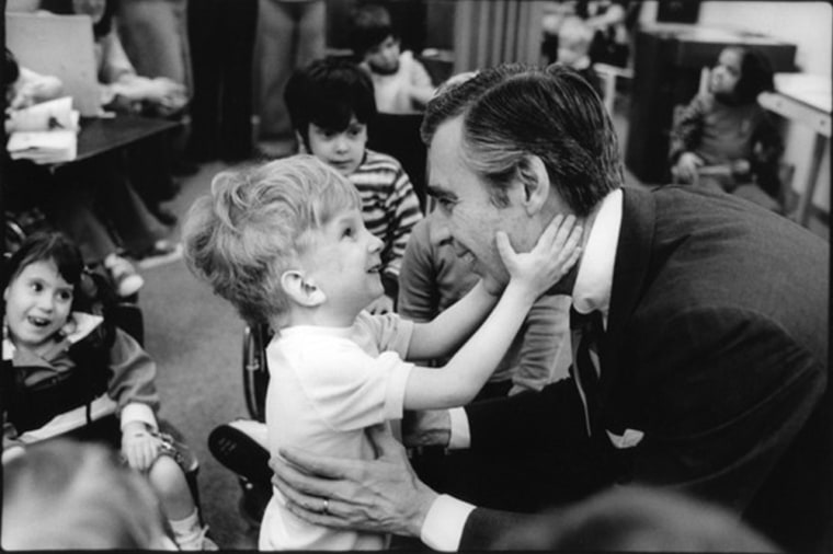 Fred Rogers meets children at a school in Pittsburgh in a photograph taken by Jim Judkis.