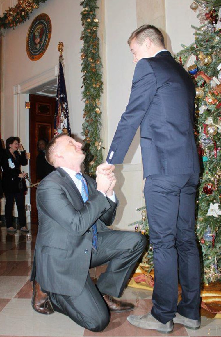U.S. Marine Corps captain Matthew Phelps gets down on one knee to propose to partner Ben Schock on Saturday night in the first same-sex marriage proposal at the White House.