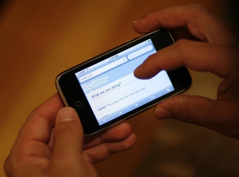 A Twitter page is displayed on an Apple iPhone in Los Angeles October 13, 2009. REUTERS/Mario Anzuoni REUTERS/Mario Anzuoni