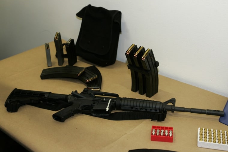 This Bushmaster AR-15 semi-automatic rifle and ammunition, shown Monday, March 27, 2006, at Seattle Police headquarters in Seattle. Private equity gia...