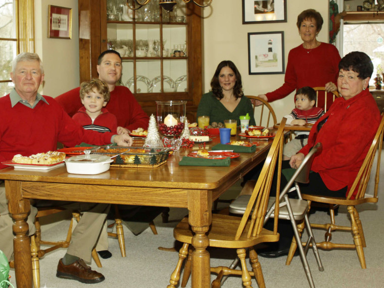 The Parker family of Pontiac, Mich., is shown on Christmas Day 2010, minutes before the clear glass baking dish at the head of the table shattered into hundreds of shards, according to Debbie Parker. Parker, standing, said she found glass pieces three feet away under the Christmas tree.