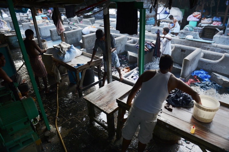 Washers clean clothes at the Dhobi Ghat in Mumbai.