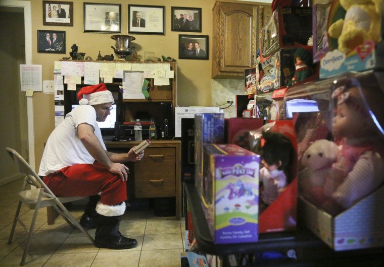 Sciaraffo, a political consultant who has worked for Hillary Clinton and City Hall, sits at his workstation in Brooklyn as he takes a phone request for a toy on Dec. 18, 2012.