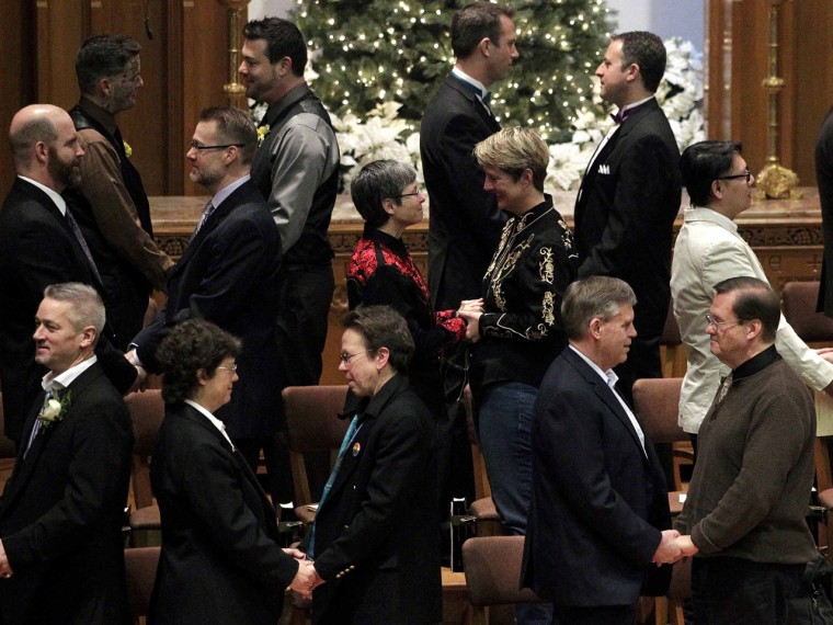 Same-sex couples take their vows during a group wedding Dec. 9 at the First Baptist Church in Seattle.