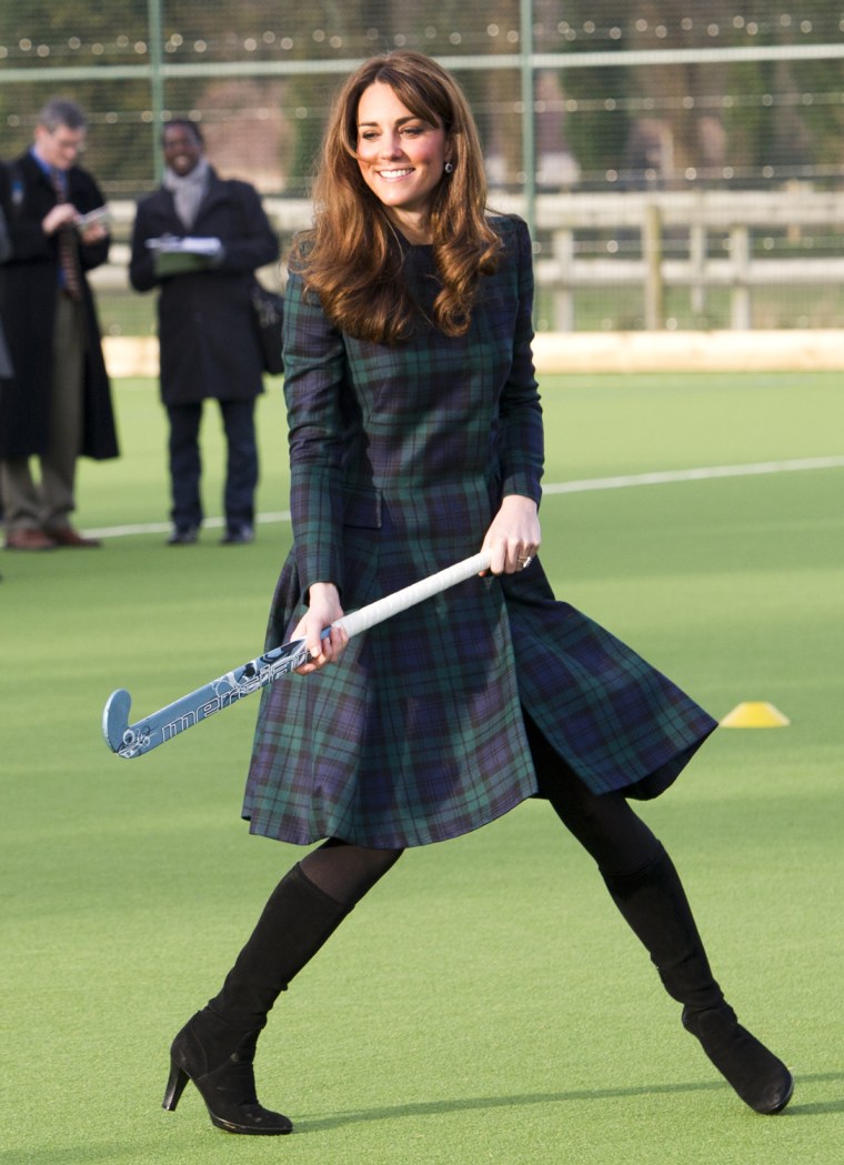 Kate visited St. Andrew's, the school she attended from 1986-1995, and paid homage to the academy's signature tartan and forest green in a plaid coatdress by McQ, a brand from the late Alexander McQueen, in Berkshire, England, on Nov. 30.