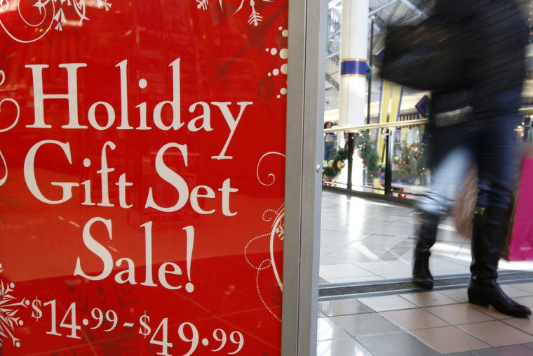 A retail store at the CambridgeSide Galleria mall in Cambridge, Mass., advertises a holiday sale, Monday, Dec. 24, 2012. Although fresh data on the ho...