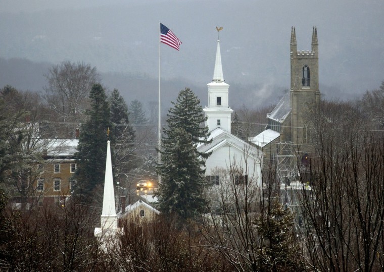 A light snow Tuesday blankets the town of Newtown, Conn., which is still reeling from the massacre at Sandy Hook Elementary less than two weeks ago.