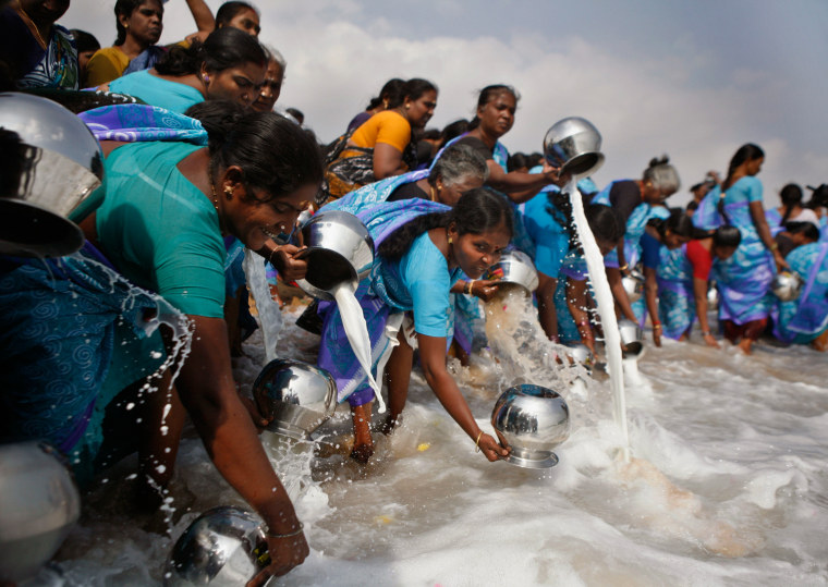 Indians perform rituals and offer milk on Marina beach, a location hit by the 2004 tsunami, in Chennai, India, on Dec. 26, 2012.