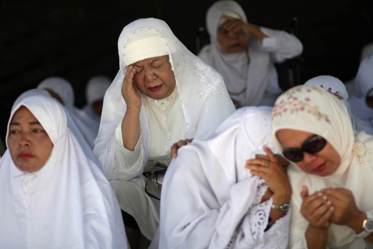 Women weep during a prayer commemorating the 8th anniversary of the Indian Ocean tsunami in Banda Aceh, Aceh province, Indonesia, on Dec. 26.