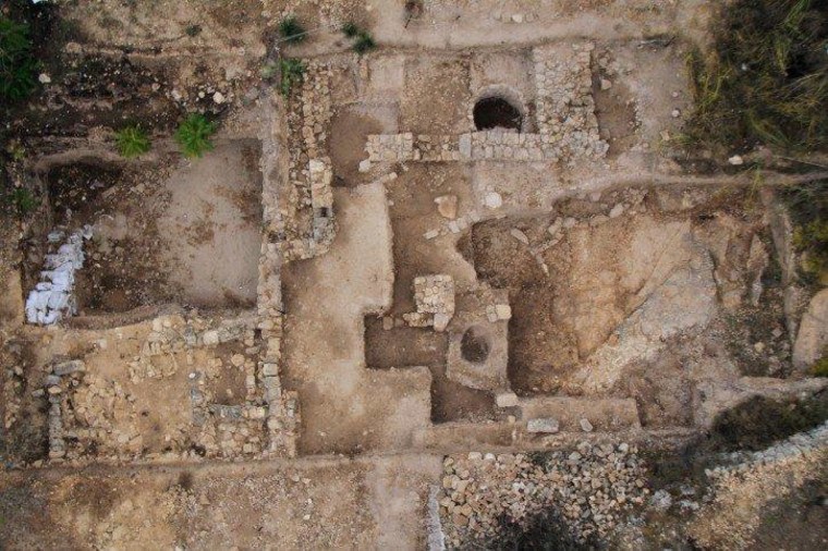 An overhead view shows the Tel Motza archaeological site.