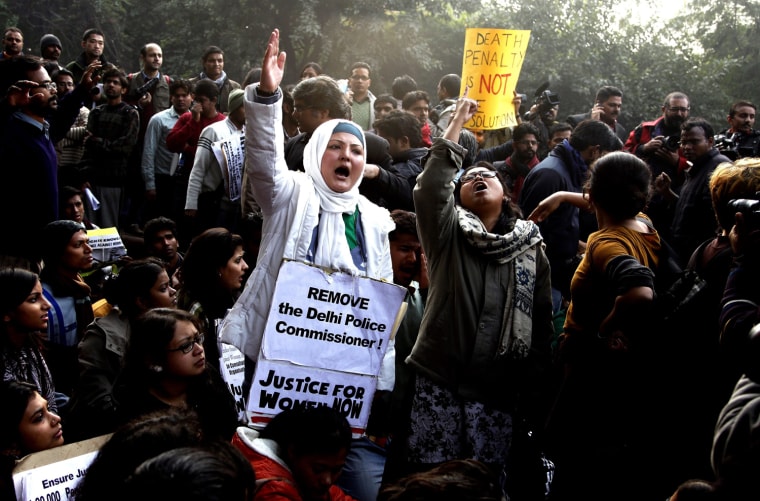 Indian students and activists shout slogans and hold placards as they participate in a protest against the recent brutal gang-rape in New Delhi, Dec. 27. The 23 year old girl who was gang-raped by 6 men on a moving bus on the night of 16 December 2012 has been shifted to Singapore hospital for further treatment.