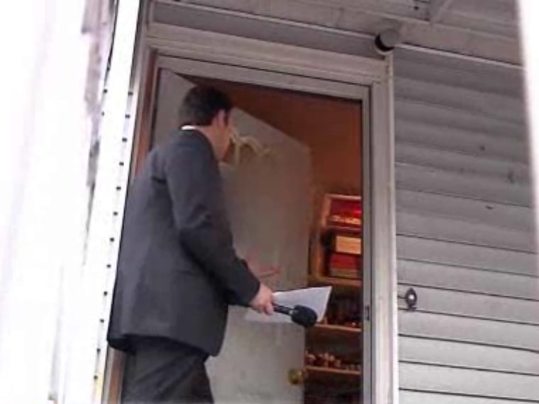Jeff Rossen interviews alleged scammer Nouel Alba through a door.