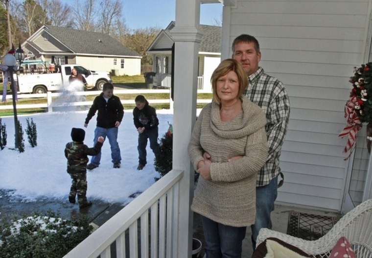 Laurie and Kevin Pearson stand in their