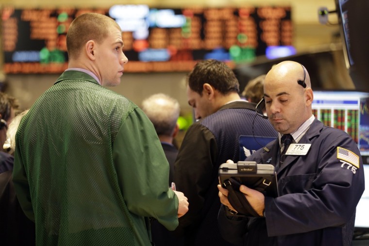 Floor traders work on the floor of the New York Stock Exchange Thursday, Dec. 27, 2012, in New York. Stocks opened lower Friday when investors cast a...