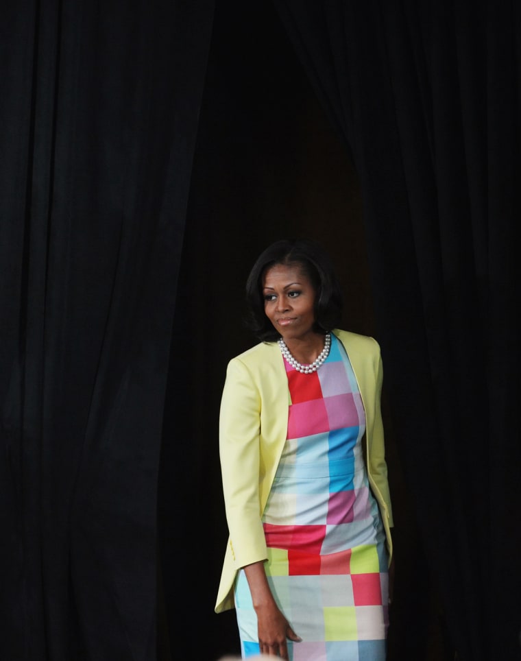 Color-coordinated: On June 5, Michelle Obama wore a colorful print dress for a press conference at the Newseum on Washington, D.C., to announce changes to Disney's nutrition guideline policy.