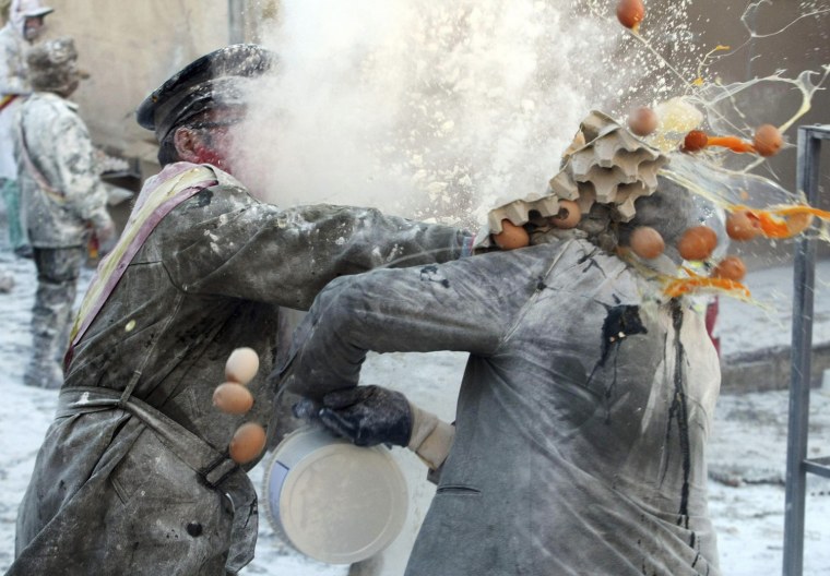 People enjoy the traditional 'Els Enfarinats' battle at Ibi in Alicante, eastern Spain, on Dec. 28.