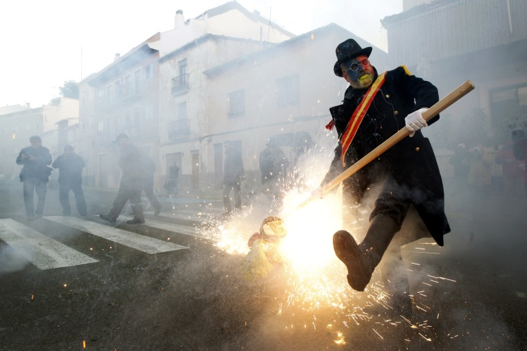 Revelers take part in festival of Els Enfarinats, in the town of Ibi near Alicante, Spain, on Dec. 28.