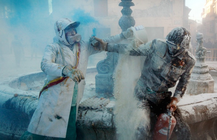 Revelers take part in festival of Els Enfarinats, in the town of Ibi near Alicante, Spain, on Dec. 28.