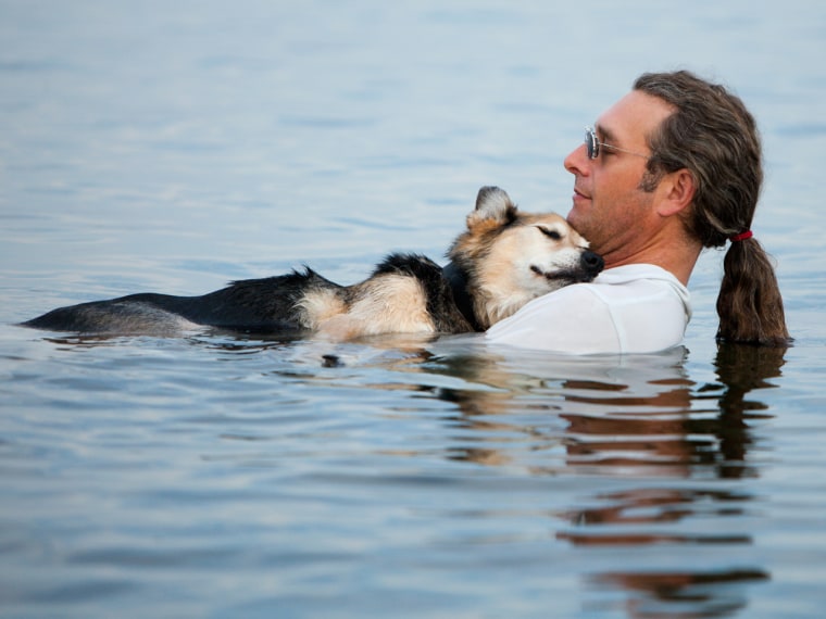John Unger helped his dog Schoep float to ease his pain.