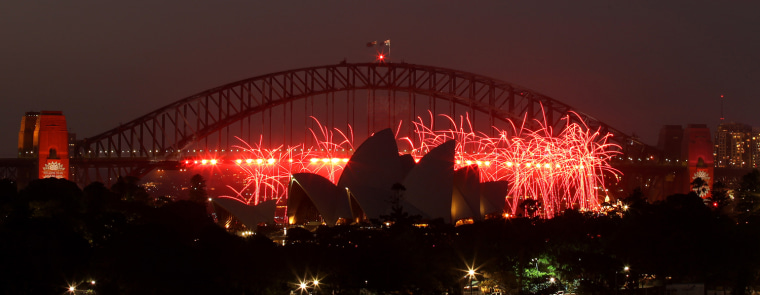 Fireworks explode around the Opera House during the pre New Year's Eve celebrations in Sydney on Dec. 31, 2012.
