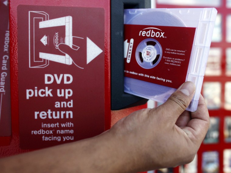 FILE - In this Aug. 7, 2009 file photo, a rental DVD is dispensed from a Redbox, a DVD movie rental kiosk, in Los Angeles. Coinstar Inc. is about much more than the green machines near grocery store checkouts that sort your loose change. Coinstar owns  Redbox DVD rental kiosks, whose surging popularity helped push Blockbuster Inc. into bankruptcy. (AP Photo/Damian Dovarganes, file)