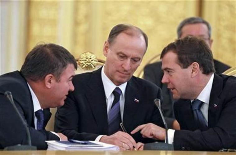 Russia's President Dmitry Medvedev (R), Security Council chief Nikolai Patrushev (C) and Defense Minister Anatoly Serdyukov attend a meeting of the Commonwealth of Independent States (CIS) leaders in Moscow's Kremlin, Dec. 10, 2010.