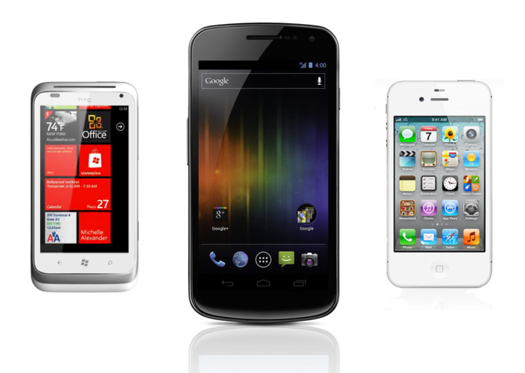 New Samsung Galaxy Nexus, running Google's Android 4.0 Ice Cream Sandwich, flanked by an HTC Windows Phone and a new iPhone 4S.