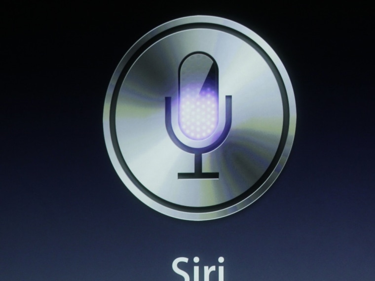 Apple's Phil Schiller talks about Siri with the new Apple iPhone 4S during an announcement at Apple headquarters in Cupertino, Calif., Tuesday, Oct. 4, 2011. (AP Photo/Paul Sakuma)
