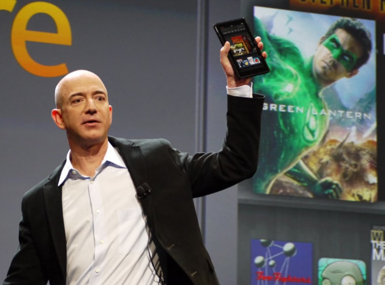 Amazon CEO Jeff Bezos holds up Kindle Fire