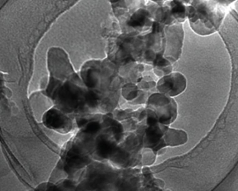 Transmission electron microscopy reveals the new conducting polymer's improved binding properties. At left, silicon particles embedded in the binder are shown before cycling through charges and discharges (closer view at bottom). At right, after 32 charge-discharge cycles, the polymer is still tightly bound to the silicon particles.