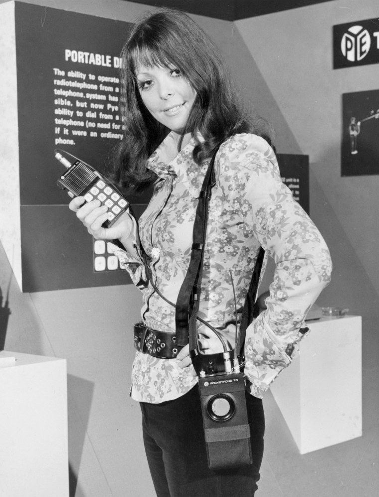 11th April 1972:  A portable radio-telephone which can dial into telephone systems, developed by Pye Telecommunications, being demonstrated at an exhibition 'Communications Today, Tomorrow and the Future', at the Royal Lancaster Hotel, London.  (Photo by Stacey/Fox Photos/Getty Images)