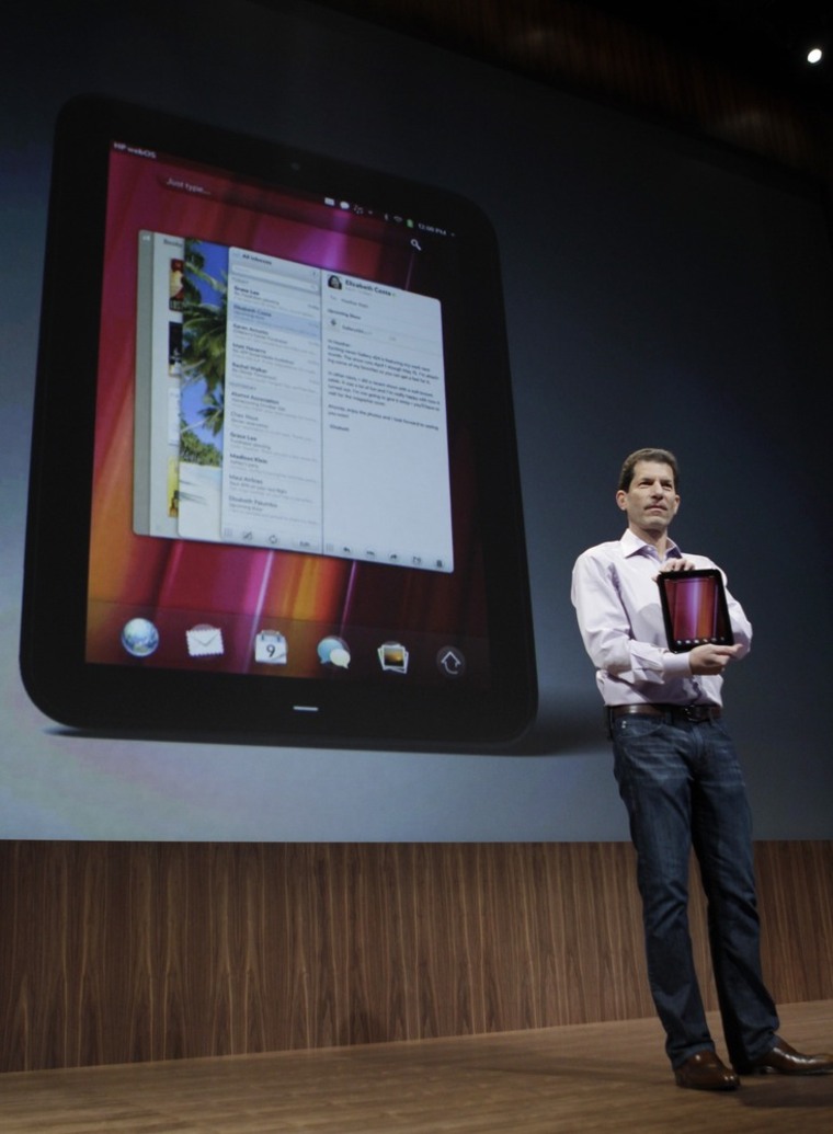 Palm CEO Jon Rubinstein, shows off the new TouchPad tablet during a Palm/Hewlett Packard announcement in San Francisco, Wednesday, Feb. 9, 2011.