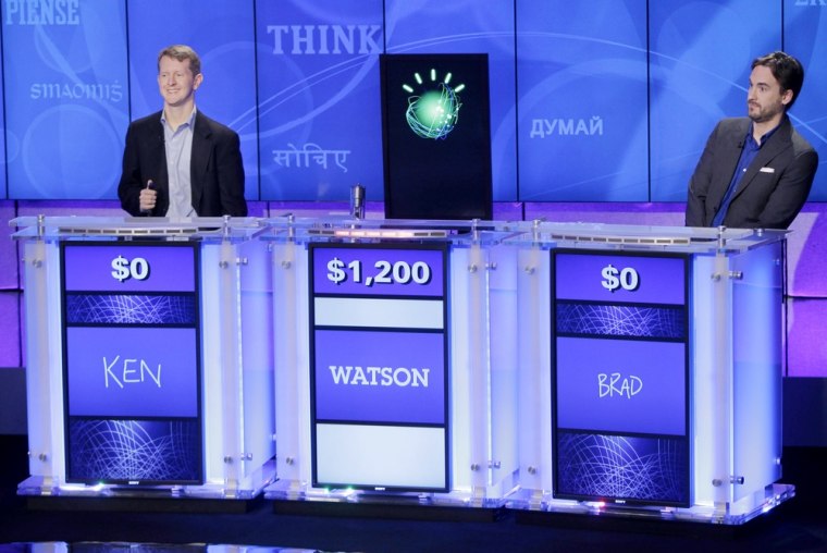 \"Jeopardy\" champions Ken Jennings, left, and Brad Rutter, right, look on as an IBM computer called \"Watson\" beats them to the buzzer to answer a question during a practice round of the \"Jeopardy!\" quiz show in Yorktown Heights, N.Y., on Thursday.
